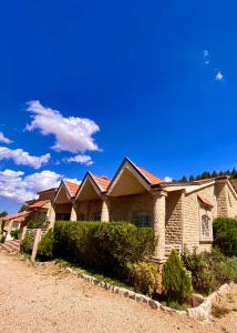 a row of houses with red roof at ATGAL Ferme D'hote in Azrou