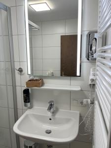 Koupelna v ubytování Gästehaus Forggensee