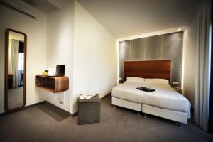 Postel nebo postele na pokoji v ubytování Q Hotel + 37 fotografií