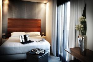 Postel nebo postele na pokoji v ubytování Q Hotel
