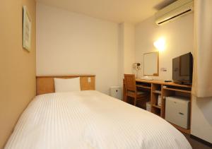 Postel nebo postele na pokoji v ubytování Business Hotel Isesaki Heisei Inn + 19 fotografií