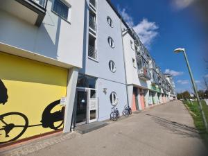 a building with a bike painted on the side of it at South Apartment - Modern & Stylish in Augsburg