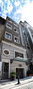 a tall building with windows and plants in front of it at Merial Hotel Sultanahmet in Istanbul