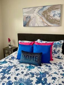 a bedroom with a bed with a home pillow on it at SUITE Queen Apart South-Bay Beaches in Gardena