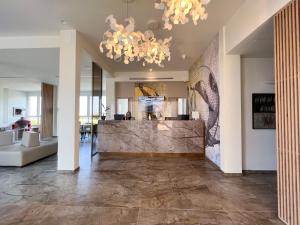 a living room with a large marble counter in the middle at Hotel Rex in Livorno