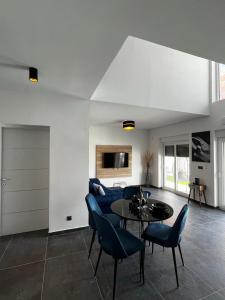 a living room with a couch and a table and chairs at LuxVilla AURORA in Vodice +43 photos