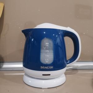 a blue and white blender sitting on a counter at Moonrise Apartment in Mostar +17 photos