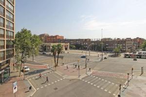 a large parking lot with people in a city at Ideal 3 bedroom apartment in Sant Andreu in Barcelona