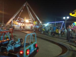 a toy truck driving on a track at a fair at Angel Room 1 in Nea Plagia