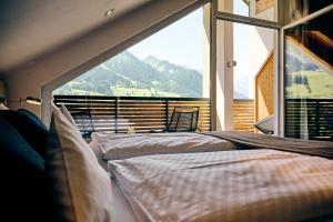 Krevet ili kreveti u jedinici u okviru objekta Genuss- & Aktivhotel Sonnenburg +37 fotografija