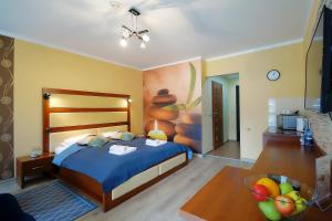 Posteľ alebo postele v izbe v ubytovaní OnHoliday Apartamenty w Hotelu przy ul Kościuszki 16