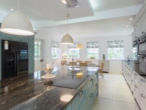 a kitchen with a large island with a counter top at Yokefleet Cottage in Eastrington