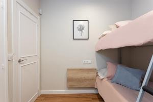 Postel nebo postele na pokoji v ubytování Sant Martí Apartment by Olala Homes
