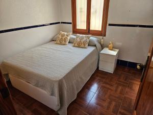Posteľ alebo postele v izbe v ubytovaní Sanchis Guarner Bajo Solo Familias Serviplaya