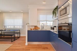 Kuchyň nebo kuchyňský kout v ubytování Sant Martí Apartment by Olala Homes
