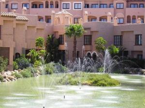 a water fountain in front of a large building at Sonsoles Apartamentos Bahía Sur in San Fernando