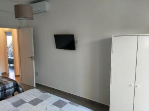 Televízia a/alebo spoločenská miestnosť v ubytovaní Il giardino dell'Etna
