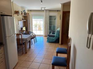 A kitchen or kitchenette at Residencial Los Almendros Playa Romana