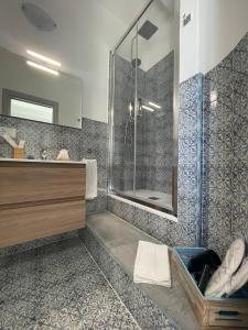 a bathroom with a shower and a sink at Casa Grazia Apartments in Lipari