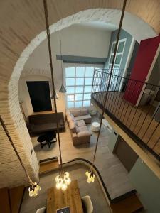 an overhead view of a living room with a staircase at Apartamentos Living Sevilla Centro Maestranza in Seville