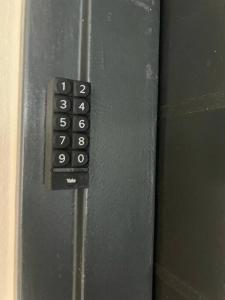 a close up of a remote control on a door at Earthy and Organic in Johannesburg