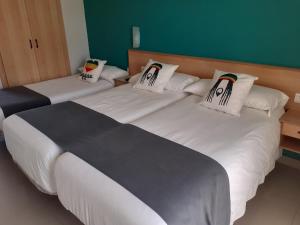 Postel nebo postele na pokoji v ubytování Hotel Clibomar Jamaica
