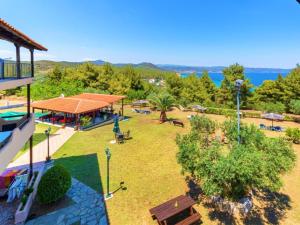 an aerial view of a yard with a park at Pension Veria Frankfurt in Akti Salonikiou