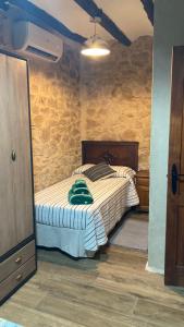 a bedroom with a bed in a room at La gallina in Arnés +15 photos