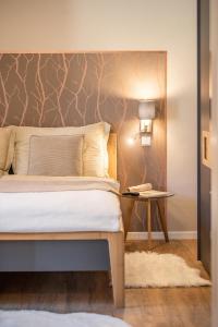 Postel nebo postele na pokoji v ubytování Appartements am Landschaweg