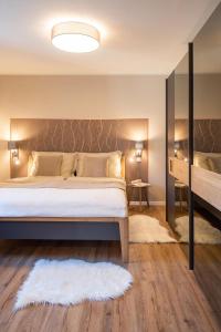 Postel nebo postele na pokoji v ubytování Appartements am Landschaweg