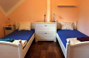 Postel nebo postele na pokoji v ubytování Penzion Pulčínské Skály