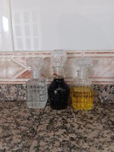 two bottles of oil sitting on top of a counter at La Favorita in Pontevedra