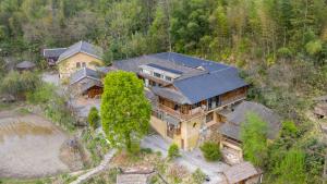 an overhead view of a house with a roof at No.5 Valley Lodge in Zhangjiajie