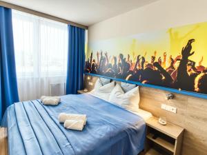 A bed or beds in a room at Hotel Familia