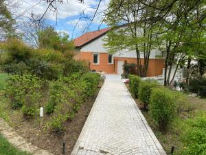 a brick walkway in front of a house at Villa Magnolia in Arcugnano