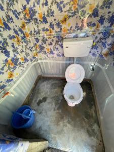 a small bathroom with a toilet in the floor at The woodswalk Treks and tours in Pahalgām