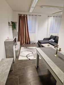 a living room with a couch and a table at Klosterappartment in Mödling