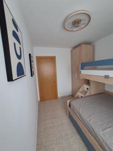 Postel nebo postele na pokoji v ubytování Résidence Maëlla