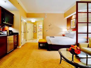 a hotel room with a bed and a living room at Amalz 2 Bedroom 3 Bathroom Balcony Suites at Mgm Signature ! in Las Vegas