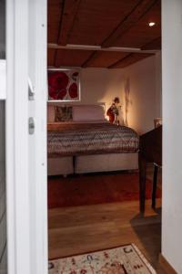 Postel nebo postele na pokoji v ubytování Seehüüsli Suite / Lake House Suite