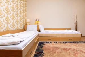 two beds sitting next to each other in a room at 1-Bedroom Flat with Balcony in Plovdiv in Plovdiv