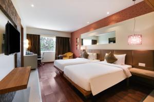 Postel nebo postele na pokoji v ubytování 7 Apple Hotel Pimpri Pune