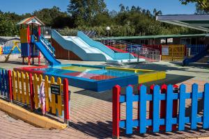 a playground with a slide and slides in a park at Camping Baltar in Portonovo