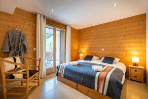 Posteľ alebo postele v izbe v ubytovaní Chalet le 4 - numéro 4 + 21 fotografií