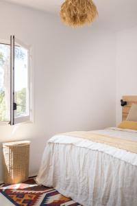 a bedroom with a bed and a window at Spacious & Luxury villa in centre Ibiza in Santa Gertrudis de Fruitera
