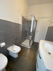 a bathroom with a shower and a toilet and a sink at La perla in Chiavari +5 photos