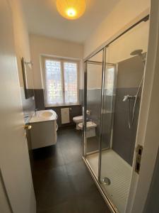 a bathroom with a shower and a sink and a toilet at La perla in Chiavari
