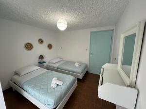 Postel nebo postele na pokoji v ubytování Ciel apartment, 5 minutes walk from Ipsos beach!