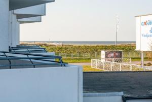 a row of bleachers with the beach in the background at Haus Hanseatic, Wohnung 111 in Duhnen