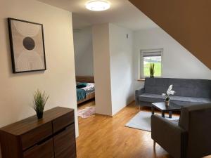 a living room with a couch and a table at SOBEL II in Tylmanowa